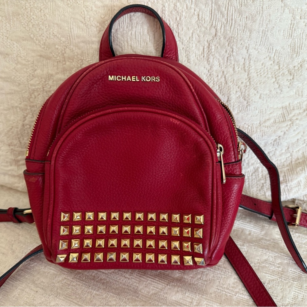 Michael Kors Abbey XS Studded Red Backpack with Gold Studs
Size 7 by 8 by 3
